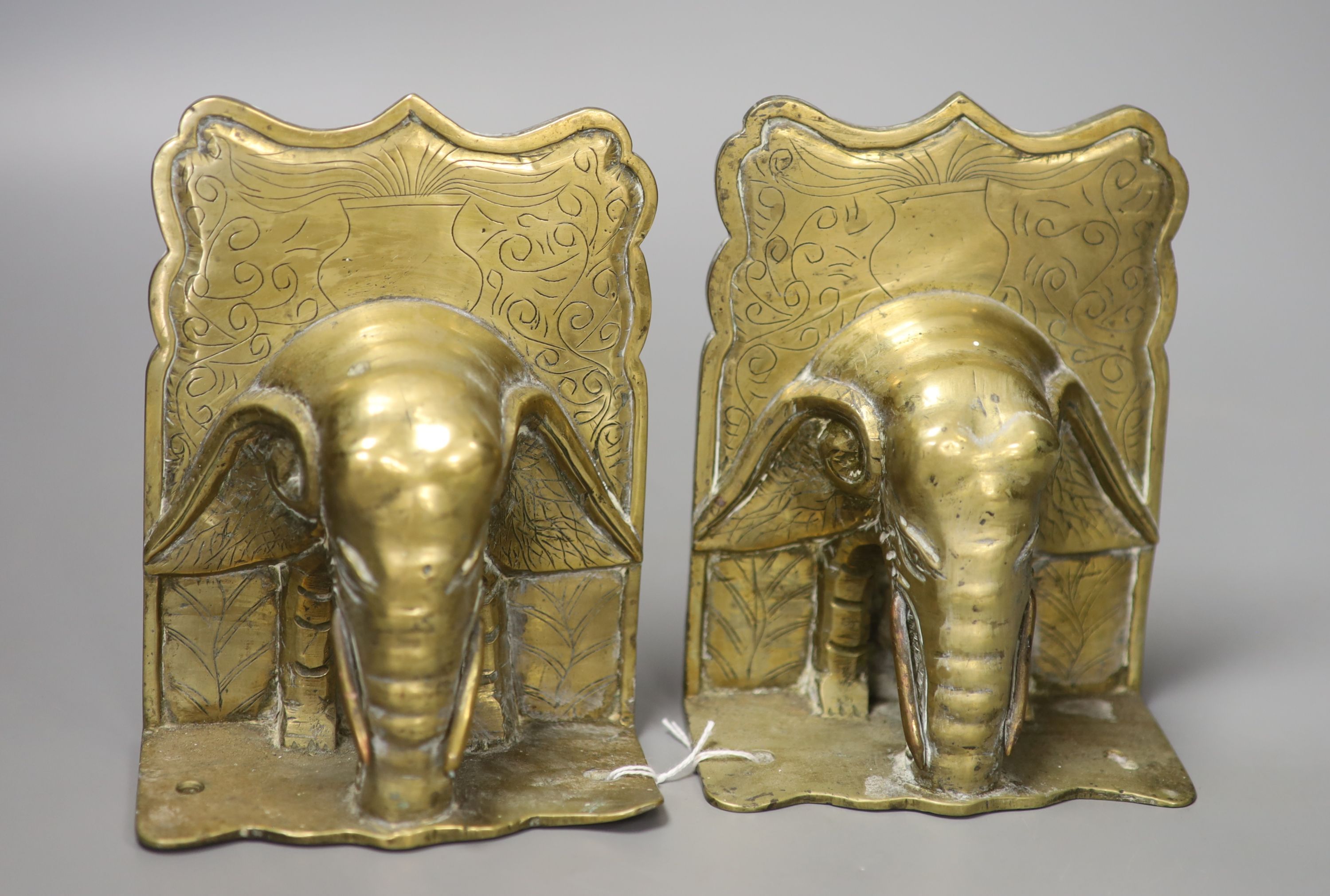 A decorative pair of early/mid 20th century Chinese brass bookends in the form of elephants, height 15cm